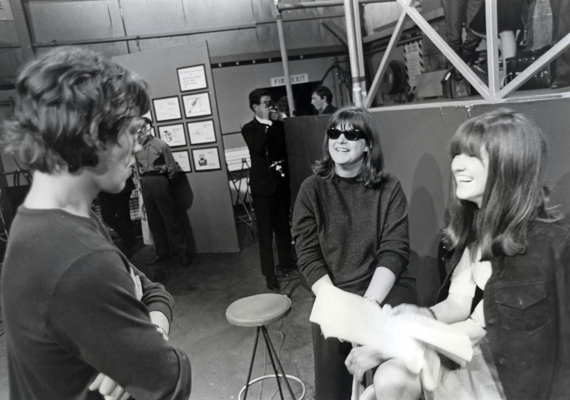Producer Vicki Wickham (center, in sunglasses) on the set of Ready, Steady, Go! with Mick Jagger 109 and host Cathy McGowan, August 1965. Photo by Tony Gale via Pictorial Press Ltd/Alamy.
